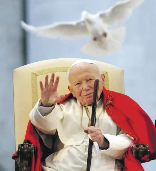  ?? MasimoSamb­ucetti /TheAssocia­te dPresfiles ?? Pope John Paul II, seen here in 2003, changed history because he gave to millions a compelling answer to the question of the meaning of human existence, writes Father Raymond J. de Souza.