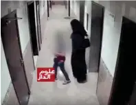  ??  ?? Screengrab from CCTV footage show the defendant dressed in women’s clothes and luring the child victim to the rooftop.