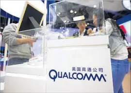  ?? Mark Schiefelbe­in Associated Press ?? ANALYSTS see Broadcom’s bid as an offensive move to take advantage of rival Qualcomm’s lagging stock price. Above, a tech conference in Beijing in April.