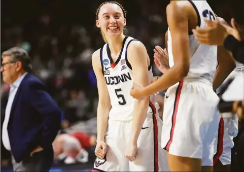 ?? Brian A. Pounds / Hearst Connecticu­t Media ?? UConn’s Paige Bueckers, shown during a Sweet Sixteen game against Indiana on March 26, has an NIL deal with Gatorade, among other brands. Now she’s adding Crocs.