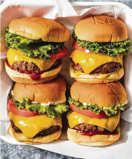  ?? Daniel J. van Ackere / America’s Test Kitchen ?? The recipe for these Classic Beef Burgers appears in the cookbook “The Ultimate Burger.”