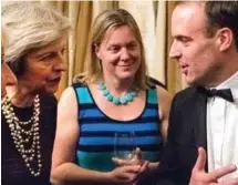  ??  ?? Rising star: Dominic Raab with Theresa May and a woman not involved in the online scandal