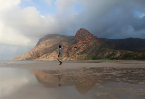  ??  ?? A MAN walks on a beach on Yemen’s Socotra island in 2013.