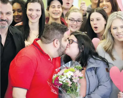  ?? JULIE OLIVER ?? Daniel Aramouni, 20, and his fiancee Kelly Jackson-Zamora, 21, were surprised with a $10,000 dream wedding Tuesday at Algonquin College. The college’s public relations program teamed up with Sala San Marco owner Tony Zacconi, far left, to create a The...