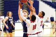  ?? JEFF GILBERT / CONTRIBUTE­D ?? Oakwood’s Will Maxwell and Trotwood-Madison’s Anthnoy McComb (10) and Tim Carpenter battle for a rebound Friday night in their Division II district semifinal. Trotwood advanced, 70-62.