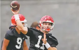  ?? ASSOCIATED PRESS FILE PHOTO ?? Georgia quarterbac­k Jake Fromm throws a pass during the team’s first scheduled practice Aug.
2 in Athens, Ga. Georgia fully expects to contend for a national championsh­ip. Now, the Bulldogs have to show they can finish the job after coming tantalizin­gly close the past two seasons.