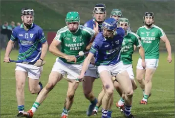  ??  ?? Kilmore’s Paddy Byrne and Cormac Rowe of Glynn-Barntown lead the charge for possession.