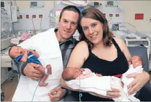  ?? Photo: WAIKATO DISTRICT HEALTH BOARD ?? Proud parents: Michael GibbsManss­en and Mandy Abraham hold their newborn triplets Damien, Maia and Viola.