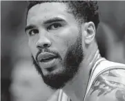  ?? Rick Bowmer/associated Press ?? Jayson Tatum and the Celtics clinched a playoff spot Saturday despite losing to the Jazz in Salt Lake City.