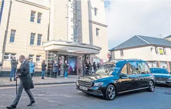  ??  ?? BOWING OUT: Sydney Devine’s funeral cortege passes by the Gaiety Theatre in Ayr.