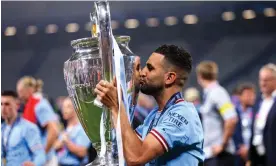  ?? League final. Photograph: Marc Atkins/Getty Images ?? Riyad Mahrez kisses the trophy after Manchester City’s win in last month’s Champions