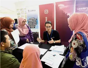  ??  ?? Opportunit­ies galore: (From left) SL1M conducting open interviews while a Leaderonom­ics trainer explains the finer points of tailoring resumes for desired jobs to graduates during the two-day Open Interview Programme organised by the SL1M secretaria­t...