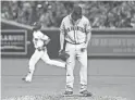  ??  ?? Diamondbac­ks Nick Ahmed rounds the bases after hitting a two-run home run off the Giants’ Andrew Suarez on Saturday.