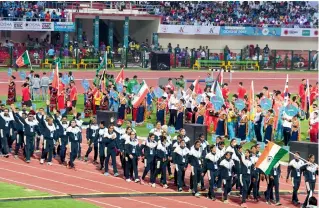  ??  ?? The Indian contingent marches in the opening ceremony of the 22nd Asian Athletics Championsh­ips at the Kalinga Stadium in Bhubaneswa­r on Wednesday. —