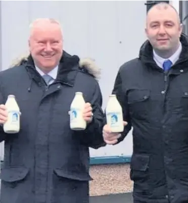  ??  ?? Cheers MSP Alex Neil and Thomson Dairies director William Thomson