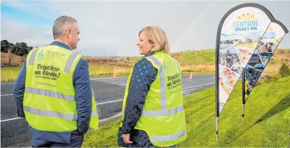  ??  ?? Under Secretary for Regional Economic Developmen­t Fletcher Tabuteau and Central Hawke’s Bay Mayor Alex Walker mark the opening of the Porangahau­Wimbledon Rd upgrade project