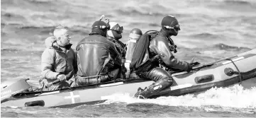  ??  ?? Divers from the Danish Defence Command preparing for a dive in Koge Bugt near Amager in Copenhagen. — AFP photo