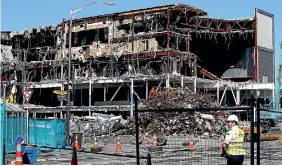  ?? PHOTO: MONIQUE FORD/FAIRFAX NZ ?? Contractor­s are still demolishin­g a cinema complex, as well as a 300-space car park at Queensgate Mall in Lower Hutt after it was deemed unsafe following November’s quake.