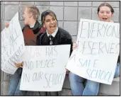  ?? K.M. Cannon Las Vegas Review-journal ?? Students, from left, Brenden Sharp,
12, Leilani Rodriguez, 15, and Leslie Leonard, 17, protest in April 2022 outside Eldorado High School It was the first day of classes after the assault of a teacher on the school campus.