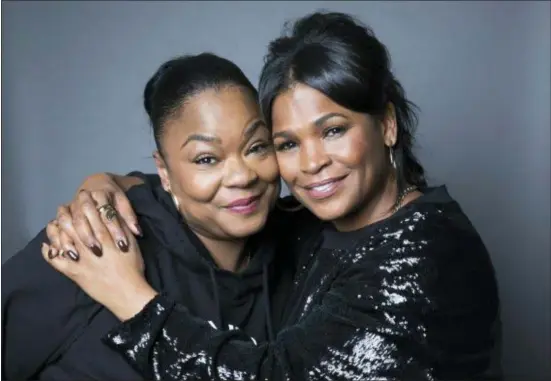  ?? PHOTO BY AMY SUSSMAN — INVISION — AP ?? Roxanne Shante, left, and Nia Long pose for a portrait in New York to promote the in the new Netflix docudrama about the rap pioneer. film, “Roxanne Roxanne.” Long plays Roxanne Shante’s mother