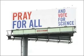  ?? Arnold Gold / Hearst Connecticu­t Media ?? One of a series of three billboards with messages incorporat­ing religion, science and voting on southbound Interstate 95 in West Haven.