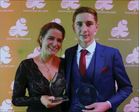  ??  ?? Joanne Allman, from Ballymacel­ligott, who won Volunteer of the Year, and Cillian Tierney, with the two awards he won, at the annual Triathlon Ireland Awards held in the Marker Hotel, Dublin last Saturday.
