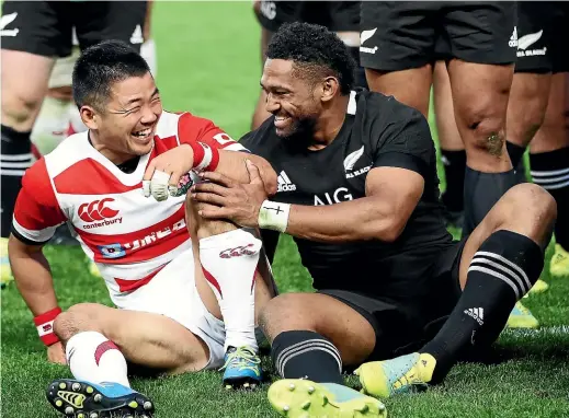  ?? GETTY IMAGES ?? ‘‘We can’t wait to get them,’’ England coach Eddie Jones said of the All Blacks. Japan’s Fumiaki Tanaka, left, and All Blacks wing Waisake Naholo find plenty to smile about after the entertaini­ng clash between the two teams in Tokyo. Next up for New Zealand is Eddie Jones’ England.