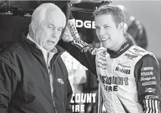  ?? Chuck Burton / Associated Press ?? Brad Keselowski, right, is heading into his final races as part of Team Penske and says he will lean on lessons learned from Roger Penske as he transition­s to Roush Fenway Racing.