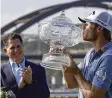  ?? ERIC GAY / AP ?? Sam Burns (right) kisses his trophy after defeating Cameron Young in the final match at the Dell Technologi­es Match Play Championsh­ip golf tournament in Austin, Texas, on Sunday.