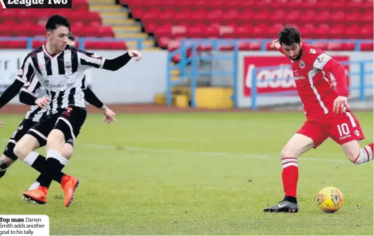  ??  ?? Top man Darren Smith adds another goal to his tally