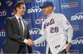  ?? Bebeto Matthews/Associated Press ?? New York Mets president of baseball operations David Stearns, left, introduces new Mets manager, Carlos Mendoza, on Tuesday at Citi Field in New York.