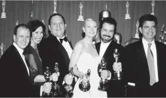  ??  ?? Harvey Weinstein with Gwyneth Paltrow at the Academy Awards in 1999