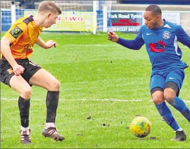  ?? Picture: Keith Davy ?? Herne Bay’s Keiron Campbell, right, looks for a way past Three Bridges