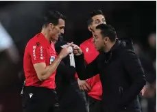  ?? Getty ?? Barca manager Xavi argues with referee Jose Munuera during the Copa del Rey semi-final defeat to Real Madrid