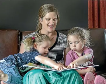  ?? JOHN KIRKANDERS­ON/STUFF ?? Anna McNabb, pictured with her daughters, Charlotte, 1, left, and Bella, 3, was ready to give up on life when she lost her hearing aged 21. But then she received a cochlear implant. She says the device saved her life. She has since gone on to establish her own business and have a family.