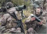  ??  ?? Loadup... Cromwell pilot Private Liam Anderson (right) prepares to load a high explosive round into a New Zealand Army 84mm Carl Gustaf medium range antiarmour weapon manned by Pte Michael Field, a police officer from Queenstown.