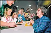  ?? VERN FISHER / AP FILE PHOTO ?? Beverly Cleary signs books at the Monterey Bay Book Festival in Monterey in this April 19, 1998, file photo. The beloved children’s author, whose characters Ramona Quimby and Henry Huggins enthralled generation­s of youngsters, died Thursday at 104.