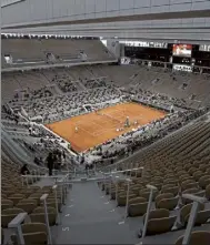  ?? Ap FILE ?? The 2021 French Open schedule is being disrupted by the coronaviru­s pandemic for the second year in a row, as organizers said Thursday the Grand Slam tournament will be delayed by one week because of surging virus cases in France.