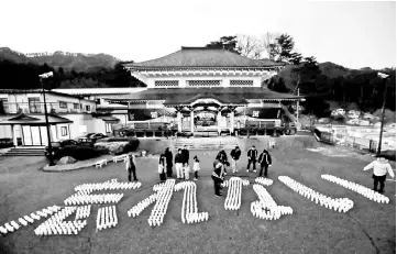  ??  ?? This March 10, 2018 picture shows LED lights displaying a message for victims of the 2011 Great East Japan earthquake that reads ‘Never Forget’ at the Senjuin temple in Kamaishi, Iwate prefecture, on the eve of the seventh anniversar­y of the massive...