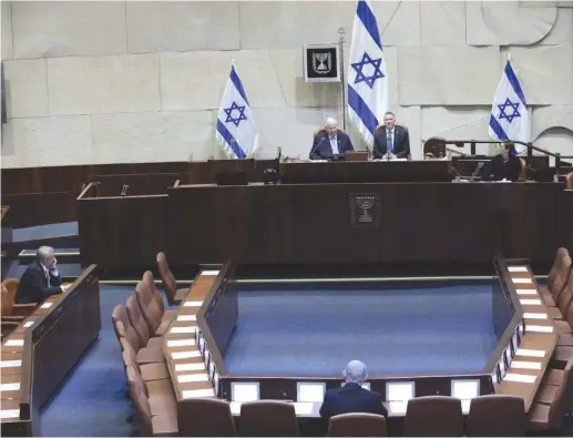  ?? (Gidon Sharon/Knesset) ?? PRIME MINISTER Benjamin Netanyahu and Blue and White leader Benny Gantz are sworn in at the Knesset.