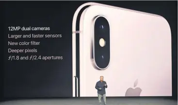  ?? JOSH EDELSON, AFP/ GETTY IMAGES ?? Peter Schiller, senior vice president ofWorldwid­e Marketing at Apple, talks about the camera in the iPhone X, which will start at $ 999. Preorders start Oct. 27.