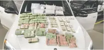  ?? ?? Police have charged four men and seized more than $1.3 million in drugs and cash following a 14-month organized crime investigat­ion.