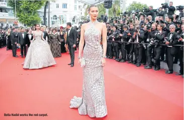  ??  ?? Bella Hadid works the red carpet.