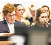  ?? Jeff Blake The State via Associated Press ?? BUSTER MURDAUGH, left, seen with girlfriend Brooklynn White, regularly attends his father’s trial at Colleton County Courthouse in South Carolina.