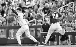  ?? PETER AIKEN/GETTY IMAGES ?? When JJ Schwarz secured the final out to clinch the Gators’ College World Series win, it put an exclamatio­n point on Florida’s dominance of LSU during the 2016-17 school year.