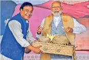  ?? PTI ?? Prime Minister Narendra Modi with Assam Chief Minister Himanta Biswa Sarma during a public meeting ahead of Lok Sabha elections, in Nalbari district, Assam on Wednesday. —
