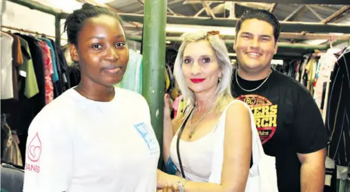  ??  ?? Lindelwa Mnqayi, Judy Bezuidenho­ut and Calvin Mey in the clothing shop at Richards Bay SPCA