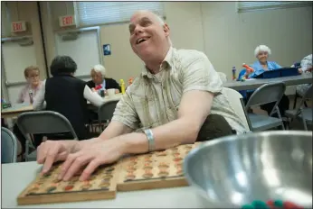  ?? NEWS-SENTINEL PHOTOGRAPH­S BY BEA AHBECK ?? Terry Joseph of Lodi plays bingo at the LOEL center in Lodi on Tuesday.