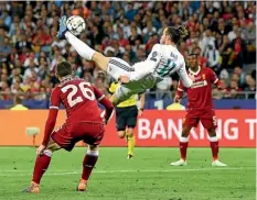  ?? GETTY IMAGES ?? Welsh wizard Gareth Bale launches into the bicycle kick that produced a breathtaki­ng second goal for Real Madrid.