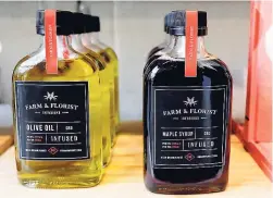  ??  ?? In this September 25, 2018 photo, bottles of maple syrup and olive oil infused with CBD marijuana extract are displayed for sale at the Village Bloomery medical cannabis dispensary in Vancouver, British Columbia.